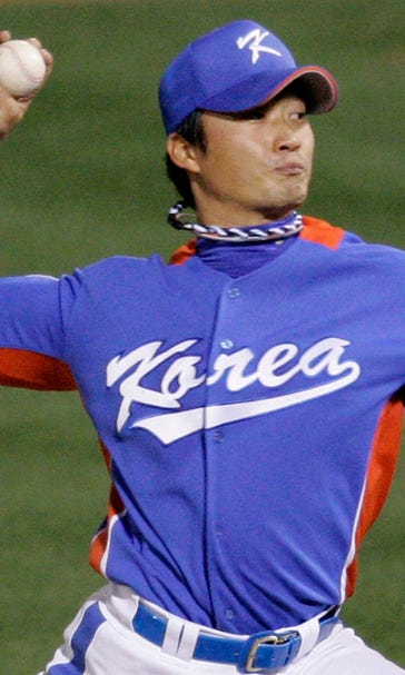 Cardinals sign Korean RHP Oh to set up Rosenthal